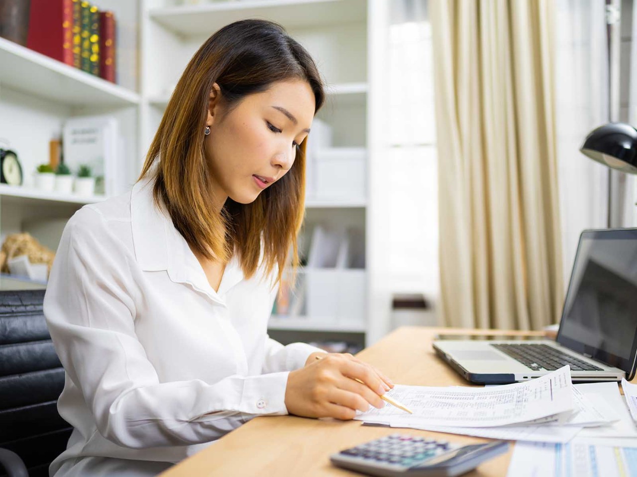 Accountant calculating tax and income in office. concept of financial advisor and accounting